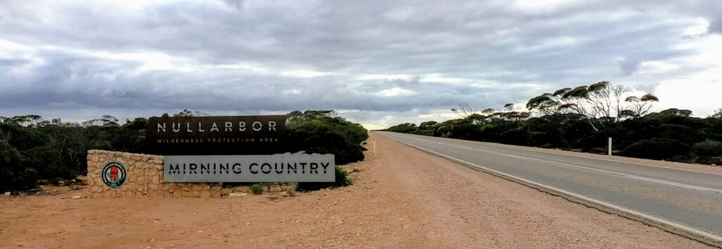 A sign showing the words Nullarbor. It's just showing the several different regions people travel through while traveling the Nullabor road.